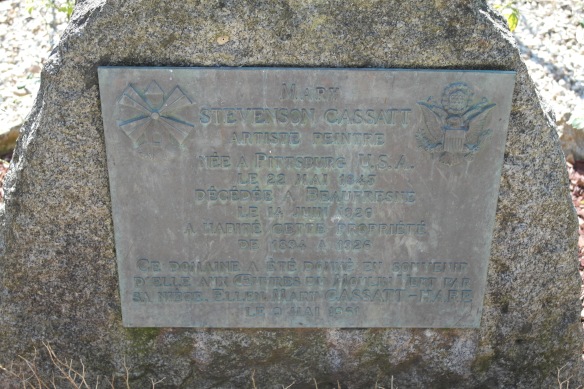 A commemorative plaque that has been placed along a walk leading from the parking lot up to the front entrance of the chateau.